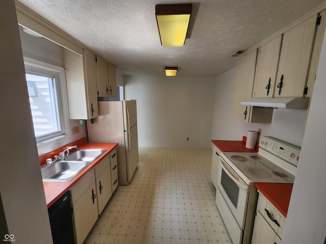 3415 Winchester Dr, Indianapolis, IN 46227 - kitchen featuring white appliances, light floors, a textured ceiling, and under cabinet range hood