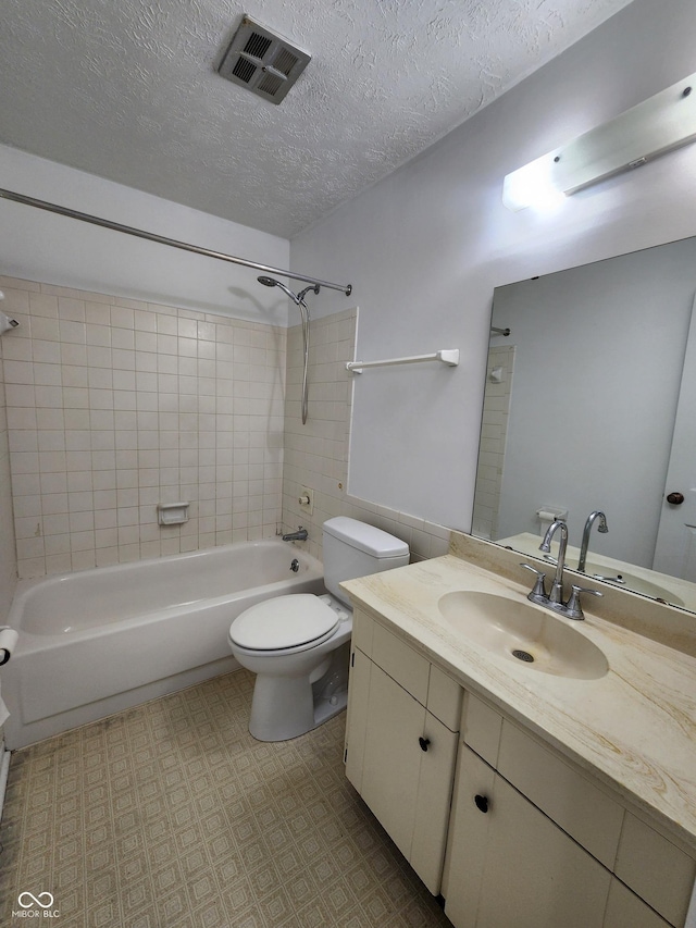 3415 Winchester Dr, Indianapolis, IN 46227 - bathroom with vanity, bathtub / shower combination, and a textured ceiling