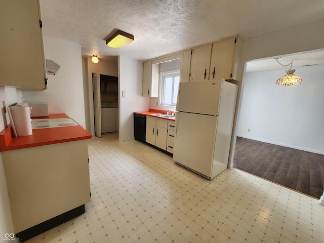 3415 Winchester Dr, Indianapolis, IN 46227 - kitchen featuring freestanding refrigerator, washer and clothes dryer, exhaust hood, stovetop, and black dishwasher
