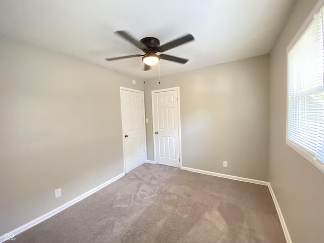 1605 S Leland Ave, Indianapolis, IN 46203 - carpeted spare room featuring ceiling fan and baseboards