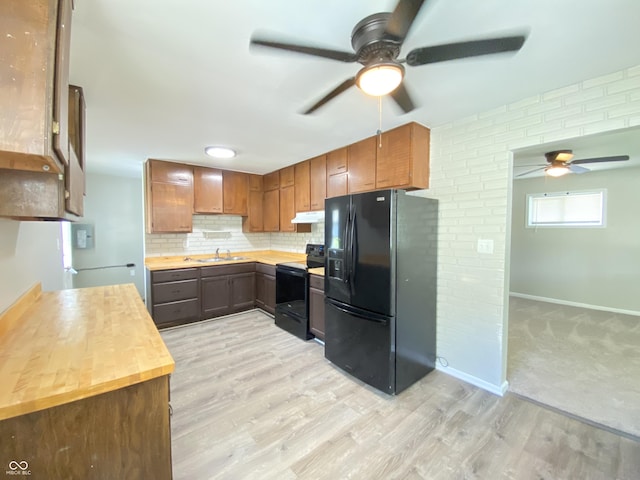 1605 S Leland Ave, Indianapolis, IN 46203 - kitchen featuring black appliances, a ceiling fan, under cabinet range hood, tasteful backsplash, and light wood-style floors