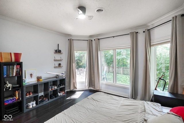 5720 Hickory Hollow Dr, Plainfield, IN 46168 - bedroom featuring wood finished floors, ornamental molding, and a textured ceiling