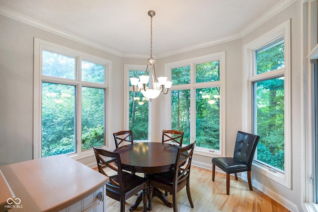 5720 Hickory Hollow Dr, Plainfield, IN 46168 - dining area with a chandelier, light wood-type flooring, and ornamental molding