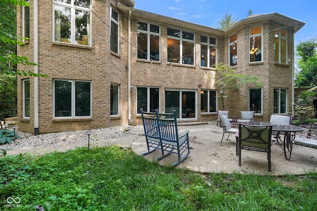 5720 Hickory Hollow Dr, Plainfield, IN 46168 - rear view of house with a patio and brick siding