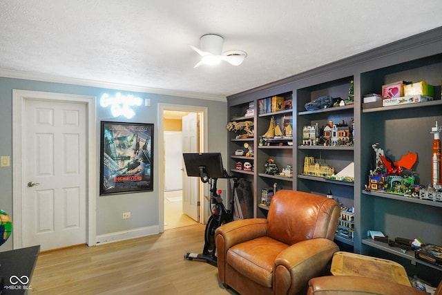 5720 Hickory Hollow Dr, Plainfield, IN 46168 - living area featuring light wood-type flooring, ornamental molding, and a ceiling fan