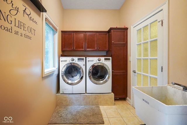 5720 Hickory Hollow Dr, Plainfield, IN 46168 - washroom featuring cabinet space, separate washer and dryer, and light tile patterned floors