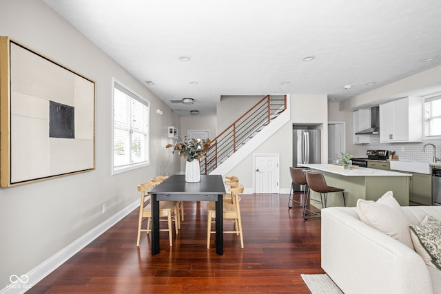 2015 N College Ave, Indianapolis, IN 46202 - living room with dark wood-style floors, stairway, and recessed lighting