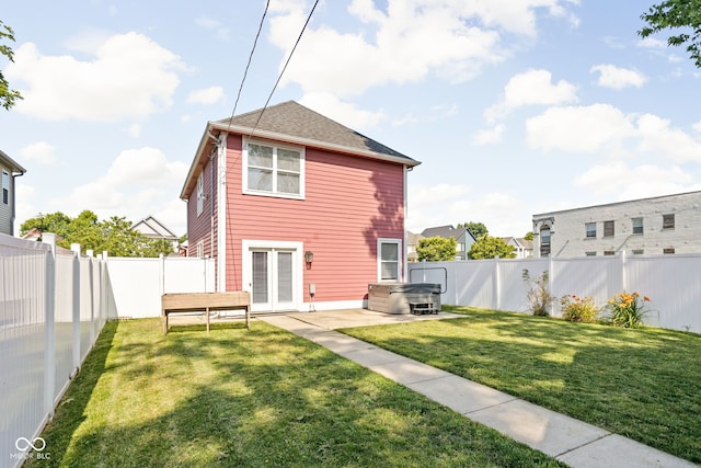 2015 N College Ave, Indianapolis, IN 46202 - rear view of property with a hot tub, a fenced backyard, a patio area, and french doors