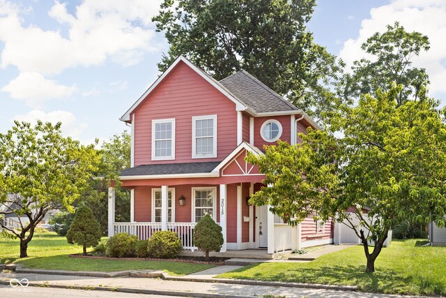 2015 N College Ave, Indianapolis, IN 46202 - traditional-style home featuring a porch, a front yard, and roof with shingles