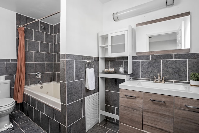 2015 N College Ave, Indianapolis, IN 46202 - bathroom with tile walls, tile patterned floors, vanity, tiled shower / bath, and wainscoting