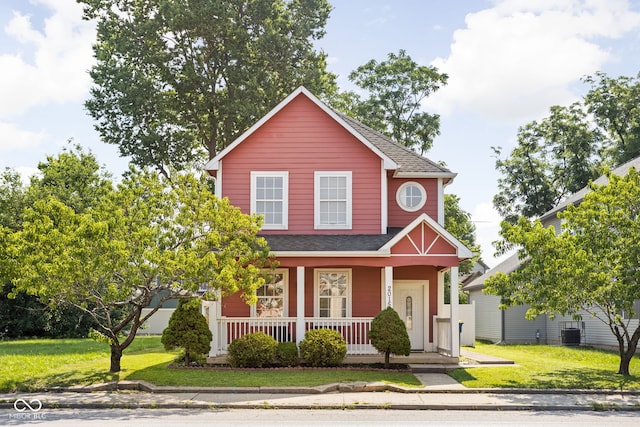 2015 N College Ave, Indianapolis, IN 46202 - traditional-style home featuring covered porch, a front lawn, and a shingled roof