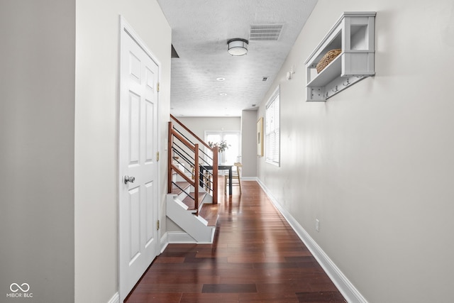 2015 N College Ave, Indianapolis, IN 46202 - hallway with stairway, wood finished floors, and a textured ceiling