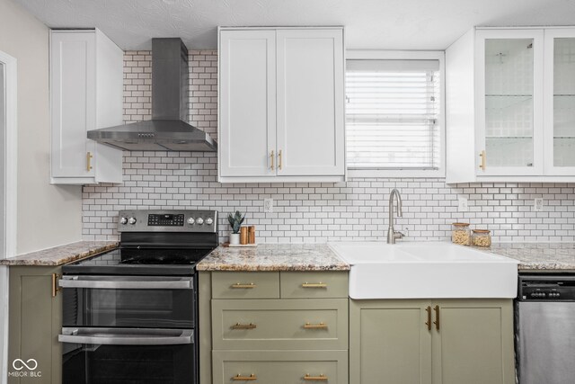 2015 N College Ave, Indianapolis, IN 46202 - kitchen with appliances with stainless steel finishes, wall chimney exhaust hood, green cabinets, and backsplash