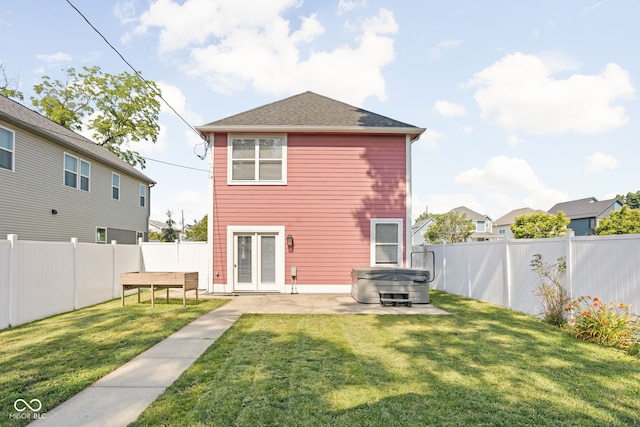 2015 N College Ave, Indianapolis, IN 46202 - rear view of house featuring a hot tub, a fenced backyard, a patio area, and french doors