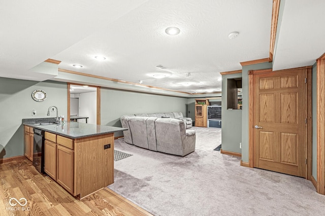 3766 Brill Rd, Indianapolis, IN 46227 - kitchen with ornamental molding, a peninsula, a textured ceiling, light wood-type flooring, and open floor plan