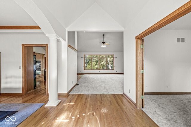 3766 Brill Rd, Indianapolis, IN 46227 - hallway with decorative columns, lofted ceiling, carpet flooring, and wood finished floors