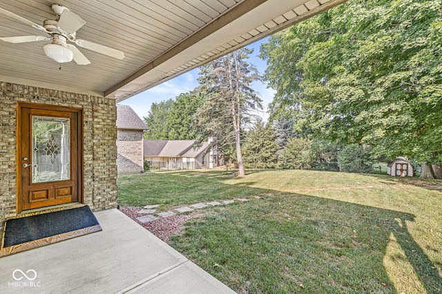 3766 Brill Rd, Indianapolis, IN 46227 - view of green lawn featuring a ceiling fan and a shed