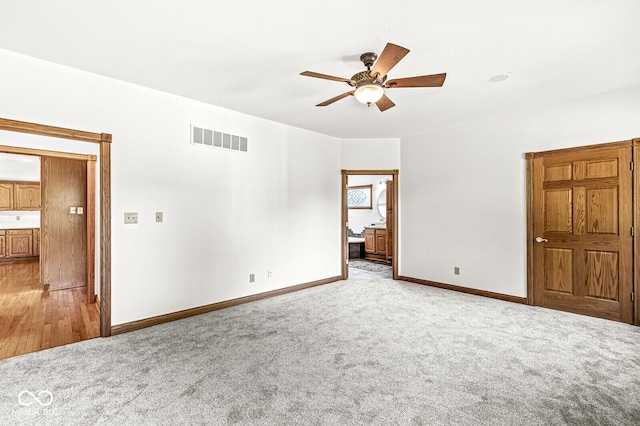 3766 Brill Rd, Indianapolis, IN 46227 - spare room featuring a ceiling fan and light carpet