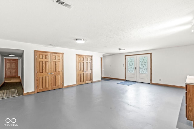 3766 Brill Rd, Indianapolis, IN 46227 - entrance foyer with concrete floors and a textured ceiling