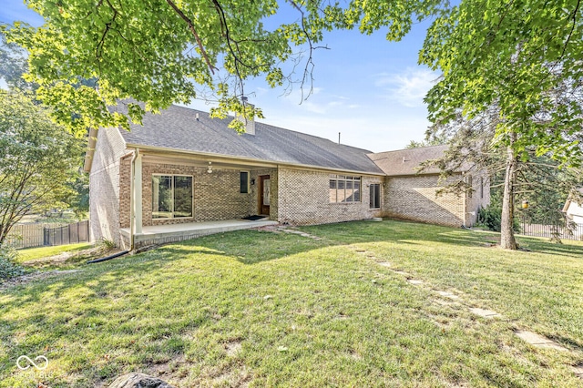3766 Brill Rd, Indianapolis, IN 46227 - rear view of property with brick siding, a patio area, and roof with shingles