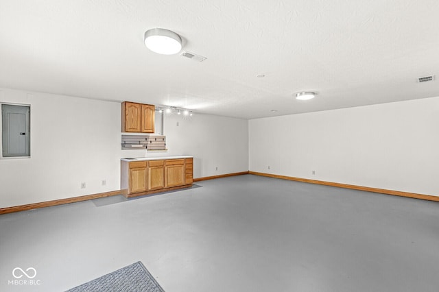 3766 Brill Rd, Indianapolis, IN 46227 - unfurnished living room featuring electric panel and finished concrete floors