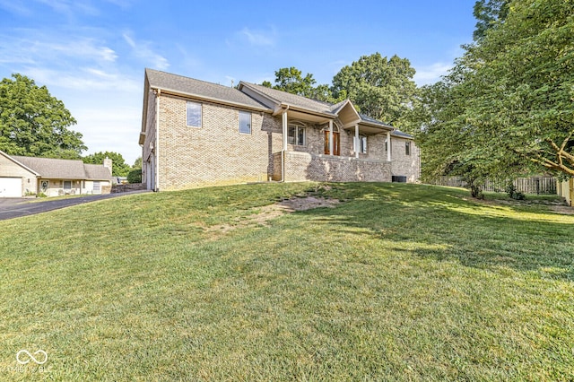 3766 Brill Rd, Indianapolis, IN 46227 - view of front of property with a front yard and brick siding