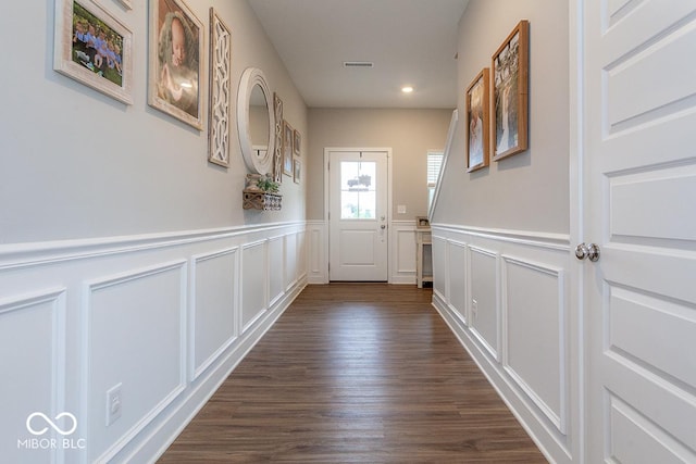 9309 Kellner St, Pendleton, IN 46064 - doorway with a decorative wall, a wainscoted wall, dark wood-type flooring, and recessed lighting