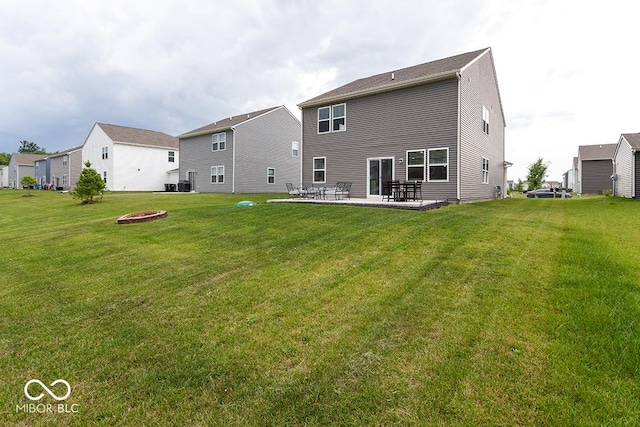 9309 Kellner St, Pendleton, IN 46064 - rear view of property with a patio area, a yard, a residential view, and an outdoor fire pit