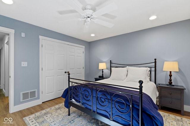 111 N 8th St, Zionsville, IN 46077 - bedroom with wood finished floors, a closet, a ceiling fan, and recessed lighting