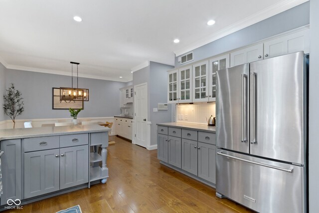 111 N 8th St, Zionsville, IN 46077 - kitchen featuring high quality fridge, gray cabinetry, ornamental molding, a chandelier, and recessed lighting