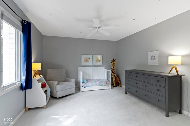 111 N 8th St, Zionsville, IN 46077 - bedroom featuring light carpet, multiple windows, and ceiling fan