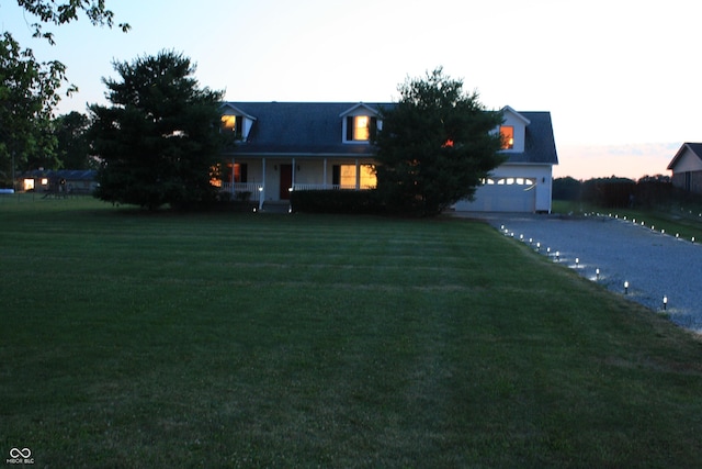 6052 N Deckshire Ln, Shirley, IN 47384 - view of front facade with asphalt driveway, a front lawn, and covered porch