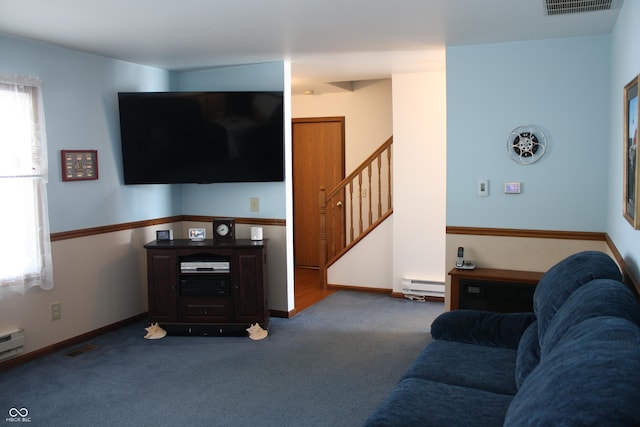 6052 N Deckshire Ln, Shirley, IN 47384 - carpeted living room featuring plenty of natural light, a baseboard heating unit, and stairway