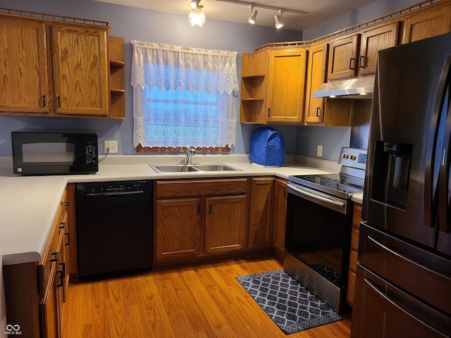 6052 N Deckshire Ln, Shirley, IN 47384 - kitchen with black appliances, open shelves, under cabinet range hood, and light wood finished floors