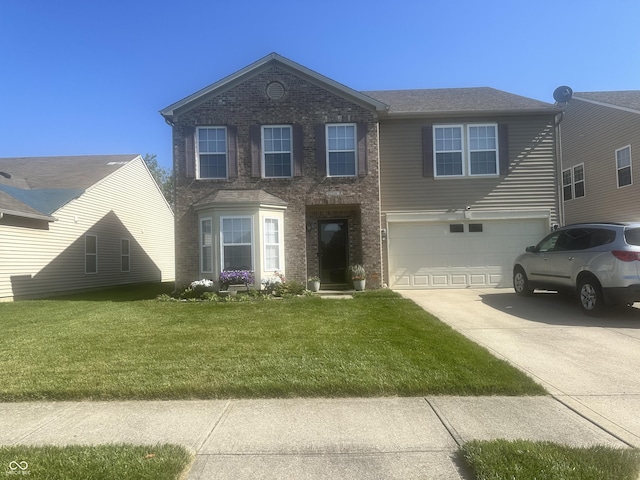 12536 Teacup Way NE, Indianapolis, IN 46235 - traditional-style house featuring a garage, concrete driveway, brick siding, and a front yard