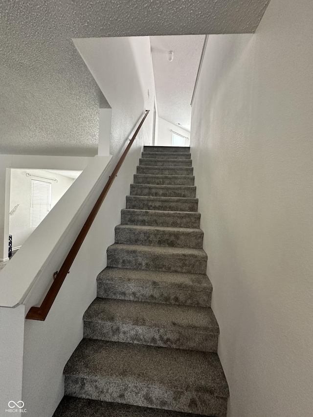 12536 Teacup Way NE, Indianapolis, IN 46235 - stairs featuring a textured ceiling