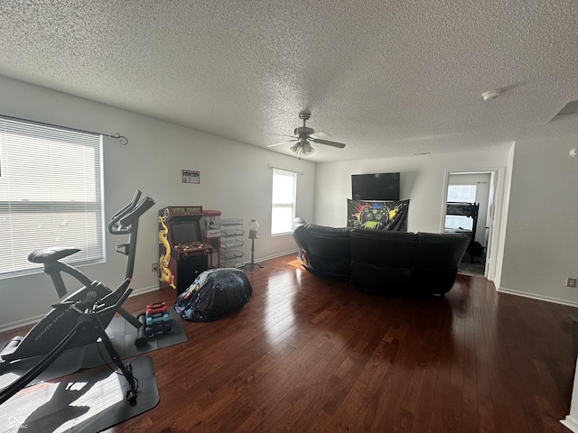 12536 Teacup Way NE, Indianapolis, IN 46235 - living area with ceiling fan, hardwood / wood-style floors, and a textured ceiling