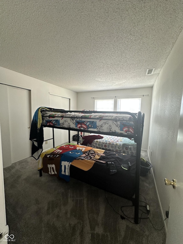 12536 Teacup Way NE, Indianapolis, IN 46235 - bedroom with carpet flooring and a textured ceiling