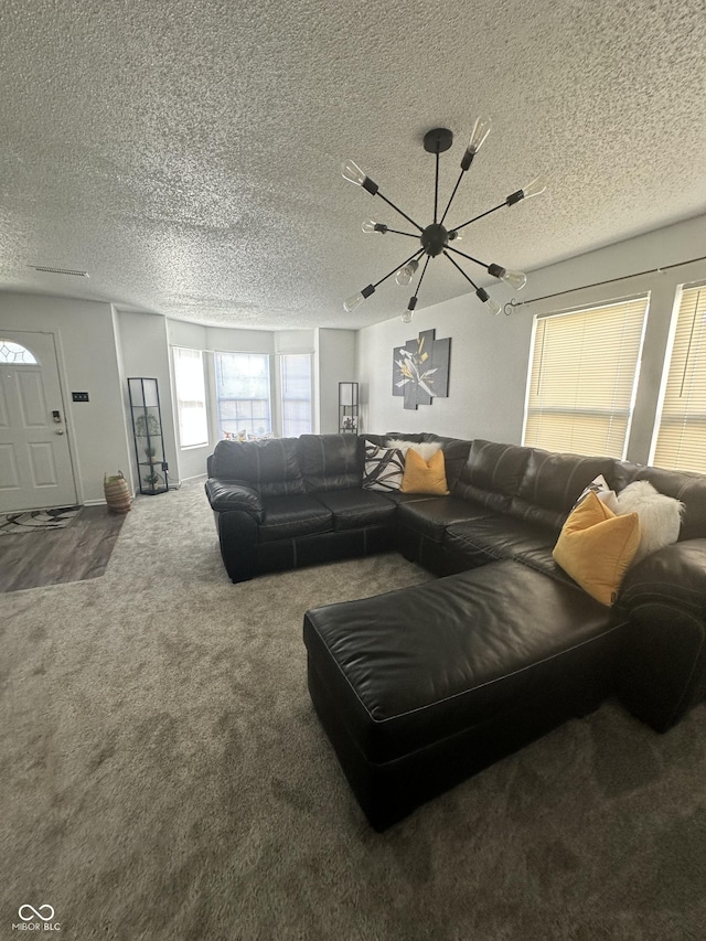 12536 Teacup Way NE, Indianapolis, IN 46235 - carpeted living area with a chandelier and a textured ceiling