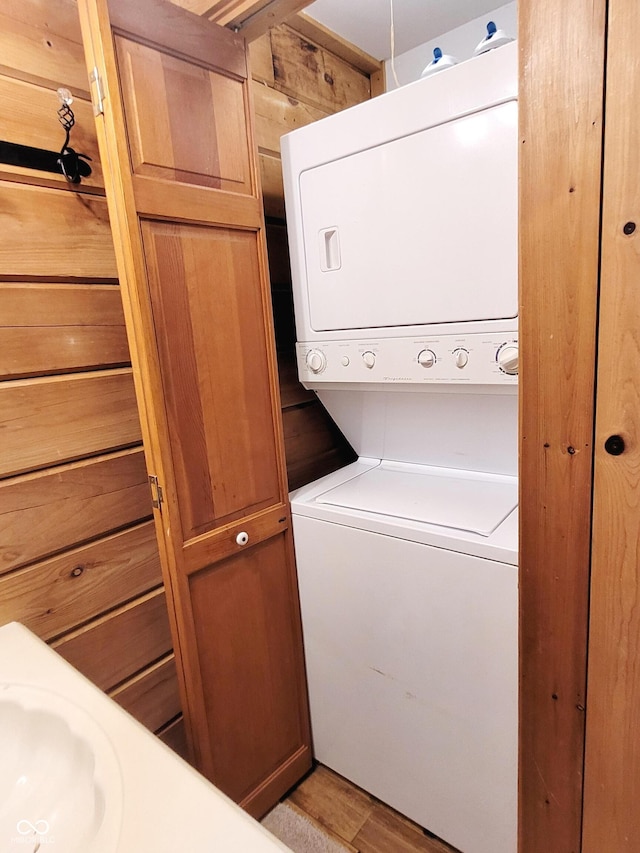 3715 Orchard Rd, Columbus, IN 47201 - laundry room with estacked washer and dryer and light wood finished floors