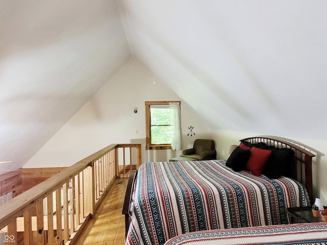 3715 Orchard Rd, Columbus, IN 47201 - bedroom with light wood-type flooring and vaulted ceiling