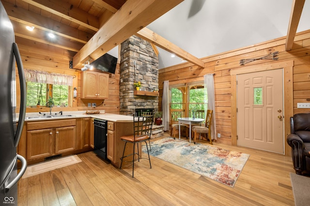 3715 Orchard Rd, Columbus, IN 47201 - kitchen with dishwasher, refrigerator, a peninsula, plenty of natural light, and wooden walls