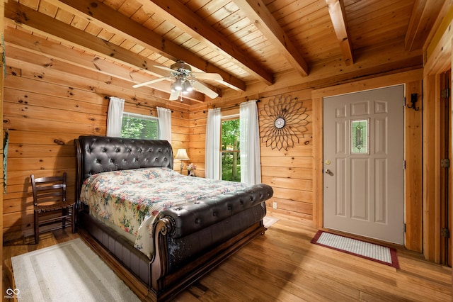 3715 Orchard Rd, Columbus, IN 47201 - bedroom featuring a wood ceiling with exposed beams, wood walls, and wood finished floors