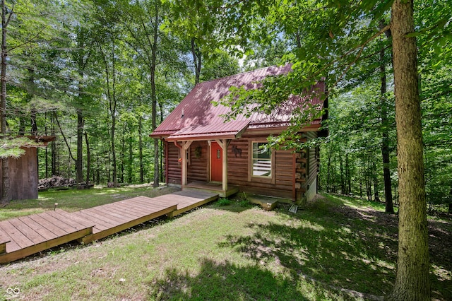 3715 Orchard Rd, Columbus, IN 47201 - back of property featuring a yard, a metal roof, log siding, and a deck