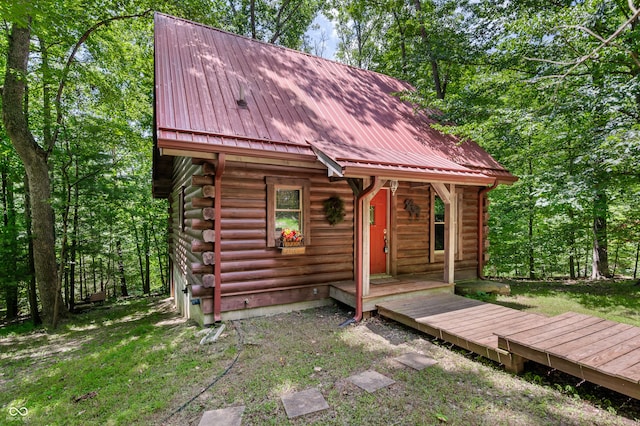 3715 Orchard Rd, Columbus, IN 47201 - view of front of house featuring log exterior and a metal roof