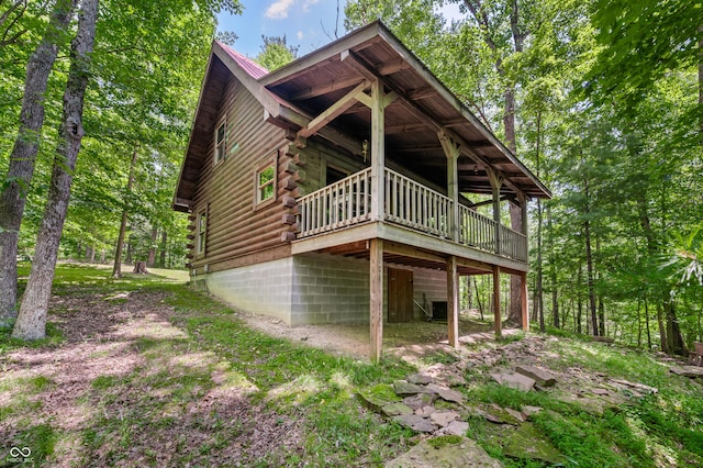 3715 Orchard Rd, Columbus, IN 47201 - view of side of property featuring log exterior and a wooden deck