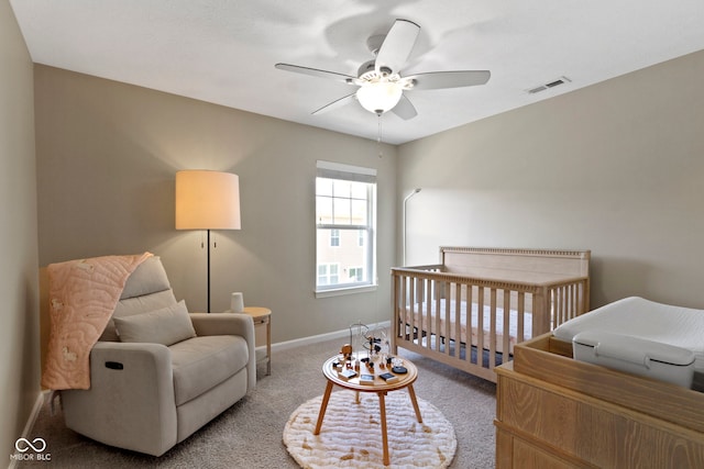 9476 Oakley Dr, Indianapolis, IN 46260 - bedroom with a nursery area, carpet flooring, and a ceiling fan