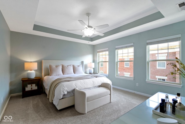 9476 Oakley Dr, Indianapolis, IN 46260 - bedroom featuring a raised ceiling, carpet, and a ceiling fan