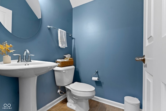 9476 Oakley Dr, Indianapolis, IN 46260 - bathroom featuring wood finished floors and toilet