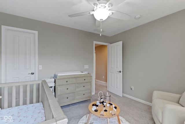 9476 Oakley Dr, Indianapolis, IN 46260 - carpeted bedroom with baseboards and ceiling fan